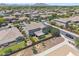 Backyard view with desert landscaping, a covered patio, and privacy fence in a residential neighborhood at 20198 E Rosa Rd, Queen Creek, AZ 85142