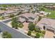 Expansive two-story home boasts a three-car garage, lush landscaping, and desert surroundings at 20198 E Rosa Rd, Queen Creek, AZ 85142