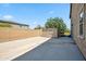 Large concrete area in backyard with storage shed, adjacent to block wall at 20198 E Rosa Rd, Queen Creek, AZ 85142