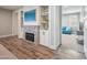 Basement room with a brick fireplace, built-in shelving, and a view into living area at 20198 E Rosa Rd, Queen Creek, AZ 85142