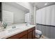 Neutral bathroom featuring double sinks, solid countertops, and modern fixtures at 20198 E Rosa Rd, Queen Creek, AZ 85142