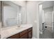 Clean, neutral bathroom with a spacious vanity and a view to an adjacent shower at 20198 E Rosa Rd, Queen Creek, AZ 85142
