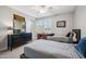 Bedroom features Michigan decor, two twin beds, and plantation shutters for natural light at 20198 E Rosa Rd, Queen Creek, AZ 85142