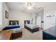 Bedroom includes two twin beds, neutral decor, and access to an ensuite bathroom at 20198 E Rosa Rd, Queen Creek, AZ 85142