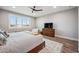Bright bedroom featuring wood floors, recessed lights and a ceiling fan at 20198 E Rosa Rd, Queen Creek, AZ 85142