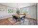 Elegant dining room with modern lighting, window shutters, and stylish decor at 20198 E Rosa Rd, Queen Creek, AZ 85142