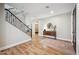 Inviting foyer with wood floors, a staircase, and decorative furnishings at 20198 E Rosa Rd, Queen Creek, AZ 85142