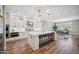 Bright, modern kitchen with a large island, pendant lighting, stainless steel appliances, and a dining area at 20198 E Rosa Rd, Queen Creek, AZ 85142