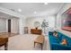 Elegant living room with hardwood floors, a blue couch, and plenty of room to relax and unwind at 20198 E Rosa Rd, Queen Creek, AZ 85142
