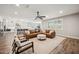 Open living space with modern furniture, natural light, and a view into kitchen at 20198 E Rosa Rd, Queen Creek, AZ 85142