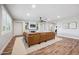 Bright living room showcasing a leather sofa, shiplap walls, and fireplace with built-ins at 20198 E Rosa Rd, Queen Creek, AZ 85142