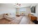 Spacious living room with a large sectional sofa, a flat-screen TV, and modern decor at 20198 E Rosa Rd, Queen Creek, AZ 85142