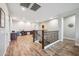 Bright loft space with wood-look floors, offering flexible living area and access to other rooms at 20198 E Rosa Rd, Queen Creek, AZ 85142