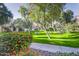 A grassy common area is surrounded by trees and flowers, offering an inviting place to relax at 2333 E Southern Ave # 2033, Tempe, AZ 85282