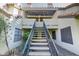 Charming two-story condo featuring an exterior staircase leading to the upper-level units with a covered patio area at 2333 E Southern Ave # 2033, Tempe, AZ 85282