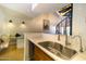 Modern kitchen with stainless steel sink, countertops, and a cozy breakfast nook at 2333 E Southern Ave # 2033, Tempe, AZ 85282