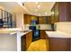 Bright kitchen with custom cabinets, stainless steel appliances, and adjacent spiral staircase at 2333 E Southern Ave # 2033, Tempe, AZ 85282