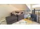Inviting living room with a comfortable couch, soft rug, and adjacent staircase at 2333 E Southern Ave # 2033, Tempe, AZ 85282