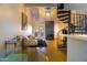 Open-concept living space features a fireplace, spiral staircase, and stylish decor for a modern and inviting atmosphere at 2333 E Southern Ave # 2033, Tempe, AZ 85282