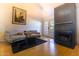 Cozy living room with a fireplace and French doors leading to the outdoors, creating a warm and inviting space at 2333 E Southern Ave # 2033, Tempe, AZ 85282