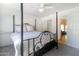 Main bedroom with a ceiling fan, comfortable bed, and a glimpse into the ensuite bathroom at 2333 E Southern Ave # 2033, Tempe, AZ 85282