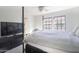 Bright and spacious main bedroom featuring large windows, and a comfy bed at 2333 E Southern Ave # 2033, Tempe, AZ 85282