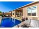 Gorgeous backyard with a sparkling pool, outdoor seating, and dining areas at 23448 N 76Th Pl, Scottsdale, AZ 85255