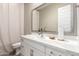 Well-lit bathroom showcasing a white vanity, stylish mirror, and modern fixtures, offering a clean and elegant design at 23448 N 76Th Pl, Scottsdale, AZ 85255