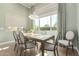 Dining room with neutral colors, views of backyard, and decorative light fixture at 23448 N 76Th Pl, Scottsdale, AZ 85255