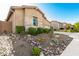 The desert landscaping offers a low-maintenance and visually appealing design at 23448 N 76Th Pl, Scottsdale, AZ 85255