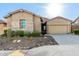 Charming home featuring desert landscaping and a neutral color palette at 23448 N 76Th Pl, Scottsdale, AZ 85255