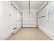 Clean, neutral garage with epoxy floor and shelving at 23448 N 76Th Pl, Scottsdale, AZ 85255