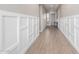 A long hallway shows high ceilings, wood floors, and decorative trim at 23448 N 76Th Pl, Scottsdale, AZ 85255
