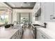 Spacious kitchen showcasing the island, dining area, and high-end appliances at 23448 N 76Th Pl, Scottsdale, AZ 85255