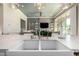 Gourmet kitchen featuring white countertops, stainless sink, and seamless connection to the living area at 23448 N 76Th Pl, Scottsdale, AZ 85255