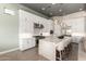 Spacious kitchen with white cabinets, stainless steel appliances, and a large island with seating at 23448 N 76Th Pl, Scottsdale, AZ 85255