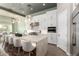 Bright, open kitchen with a large island, white cabinets, and stainless steel appliances at 23448 N 76Th Pl, Scottsdale, AZ 85255
