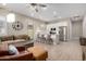 Bright living area with a view into kitchen with stainless appliances and breakfast bar seating at 23448 N 76Th Pl, Scottsdale, AZ 85255