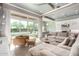 Bright living room featuring tile floors and a large sliding glass door leading to the patio at 23448 N 76Th Pl, Scottsdale, AZ 85255