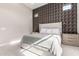 Elegant bedroom with accent wall, comfortable bed, and ample natural light at 23448 N 76Th Pl, Scottsdale, AZ 85255