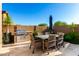 Covered outdoor dining area with barbecue at 23448 N 76Th Pl, Scottsdale, AZ 85255