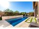 Stunning pool with a desert mountain-themed water feature at 23448 N 76Th Pl, Scottsdale, AZ 85255