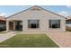 Newly built home featuring a xeriscaped backyard with rocks and artifical turf at 25727 N 161St Ave, Surprise, AZ 85387