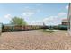 Desert landscaped backyard with low maintenance gravel and artificial turf sections at 25727 N 161St Ave, Surprise, AZ 85387