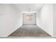 Spacious carpeted bedroom featuring a ceiling fan and natural light from a window at 25727 N 161St Ave, Surprise, AZ 85387
