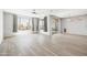 Spacious living room featuring wide plank floors and large windows that fill the room with natural light at 25727 N 161St Ave, Surprise, AZ 85387