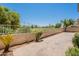 Backyard with tiled patio, lush landscaping, and golf course view offers serene outdoor living at 2647 N Miller Rd # 6, Scottsdale, AZ 85257
