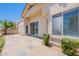 Charming backyard with tiled patio and lush landscaping, perfect for outdoor entertaining and relaxation at 2647 N Miller Rd # 6, Scottsdale, AZ 85257