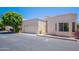Charming single-story home featuring a private garage and well-maintained landscaping at 2647 N Miller Rd # 6, Scottsdale, AZ 85257