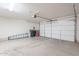Spacious two car garage with automatic opener and concrete floor provides ample parking and storage at 2647 N Miller Rd # 6, Scottsdale, AZ 85257